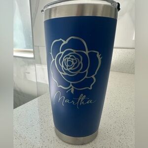 BRAND NEW. Blue Stainless Tumbler with Floral Design and the name “Martha” on it